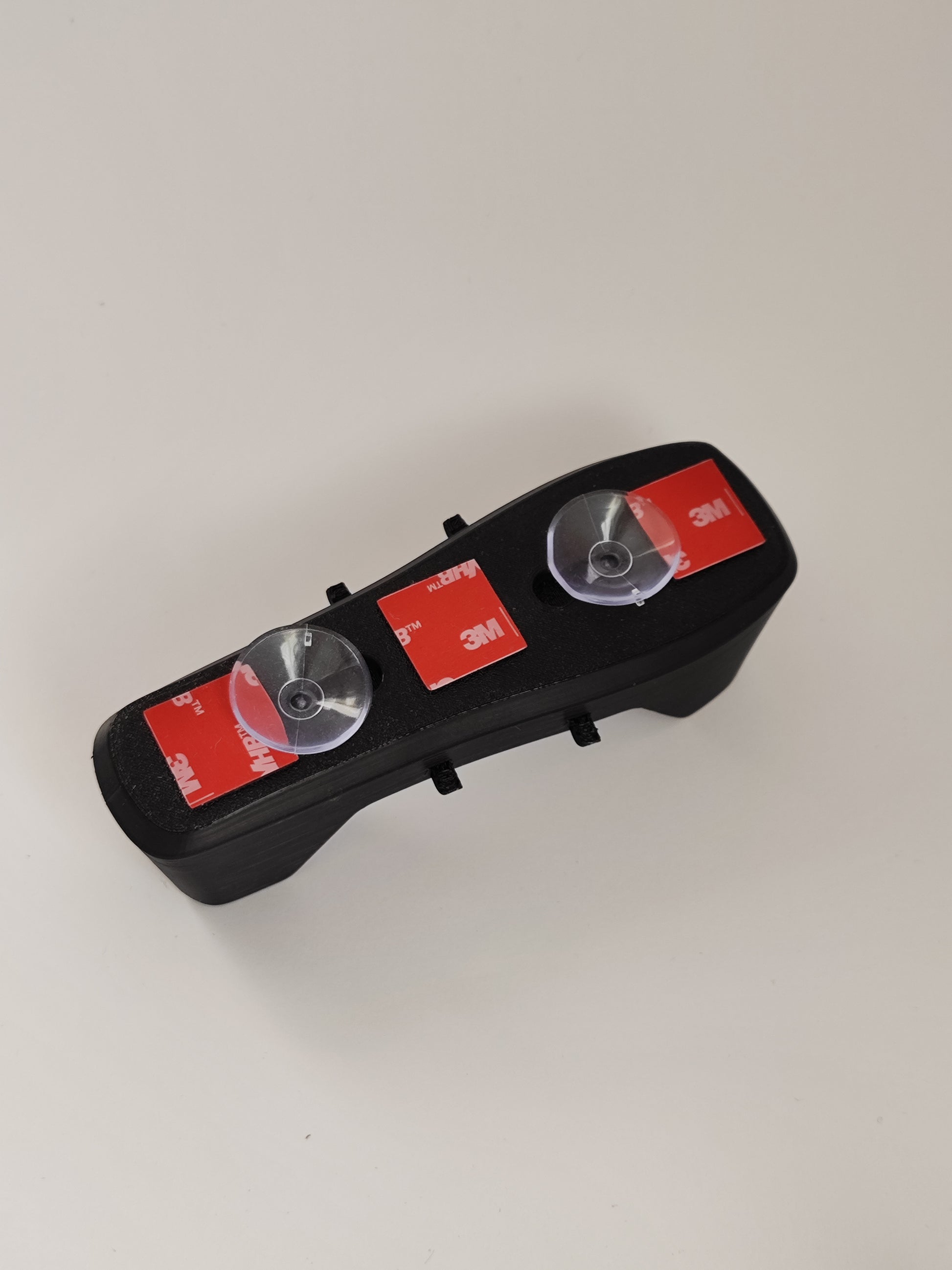 Suction cups attached to Bose controller mount for cockpit window installation
