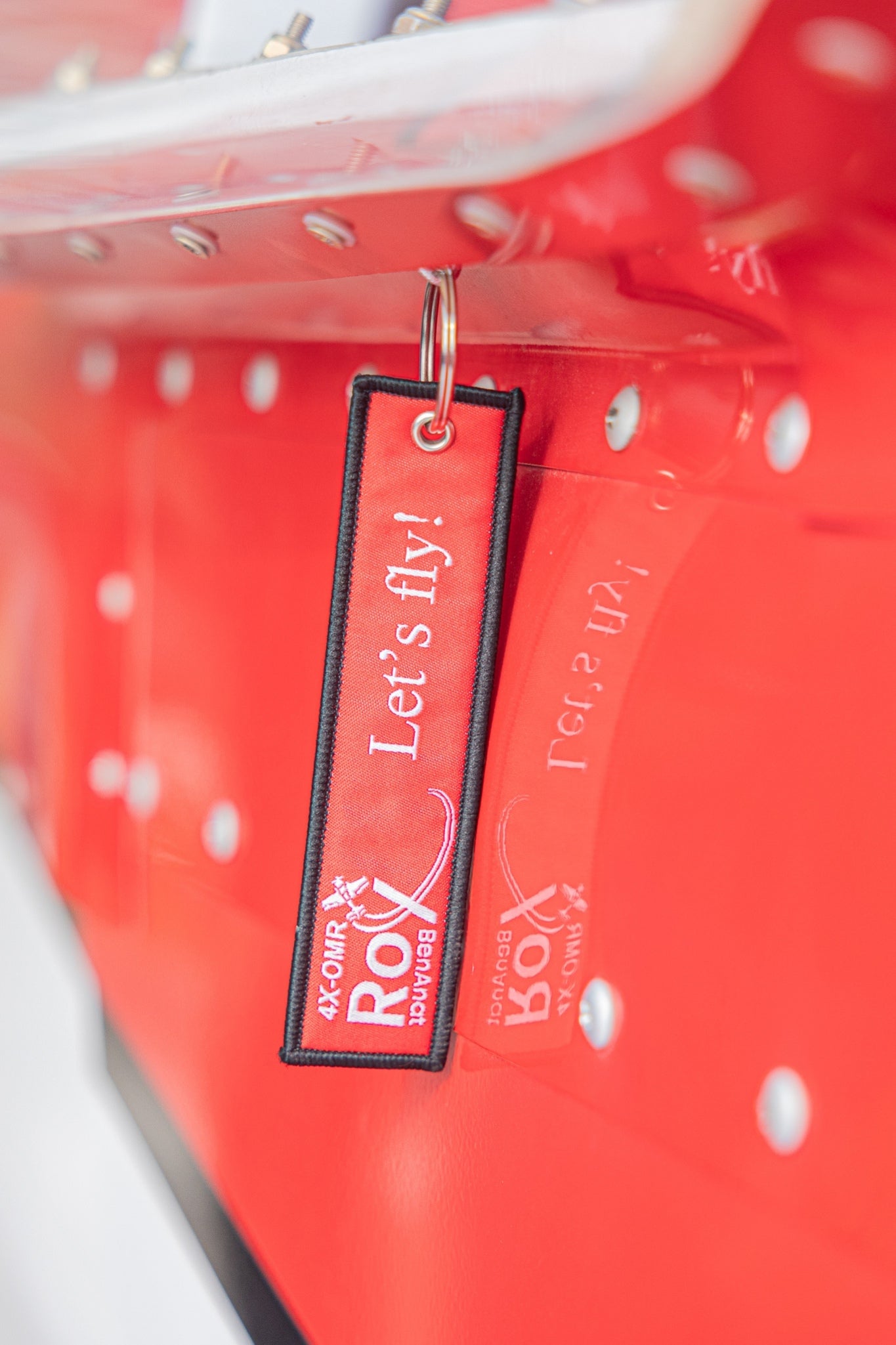 Aviation-themed keychain attached to keys – lifestyle image